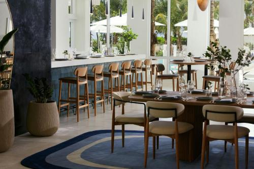 a row of tables and chairs in a restaurant at Fort Lauderdale Marriott Pompano Beach Resort in Pompano Beach