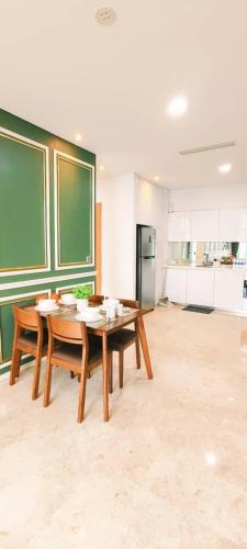 a room with a table and chairs in a classroom at Sky Suites KLCC by TD Luxe Global in Kuala Lumpur