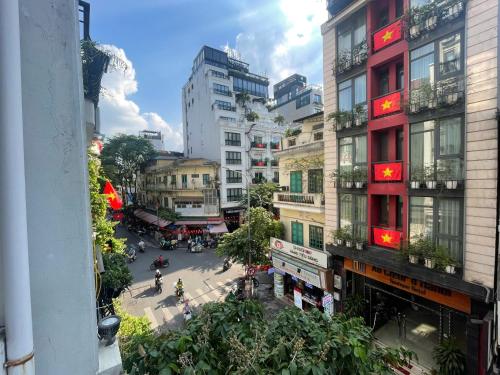 an overhead view of a city street with tall buildings at Wild LoTus Ha Noi in Hanoi
