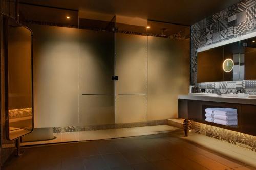 a bathroom with a shower and a sink at W Philadelphia in Philadelphia