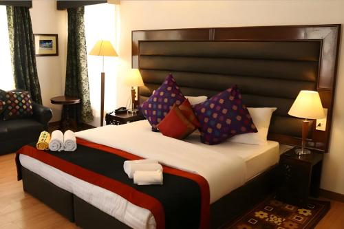 Una cama o camas en una habitación de Gomang Boutique Hotel