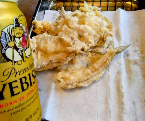 a close up of a piece of food next to a bottle at Nagata House in Ise