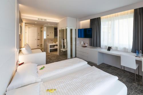 Letto o letti in una camera di Wellness Hotel Casa Barca (Adult Only)
