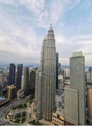 a view of a tall building in a city at Sky Suites KLCC by TD Luxe Global in Kuala Lumpur