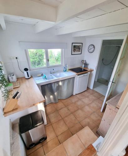 an aerial view of a kitchen with a sink at Le Petit Verger Gîte in Bonnes