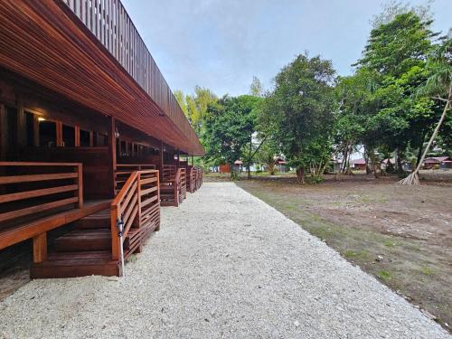 a building with a row of stalls on the side of it at Andau Dive Resort Raja Ampat in Tapokreng