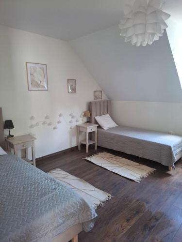 Katil atau katil-katil dalam bilik di Apartamenty TUTERRA IV