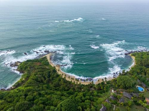 an aerial view of the ocean and a beach at Villa Sathkara in Tangalle