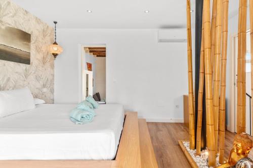 Ένα ή περισσότερα κρεβάτια σε δωμάτιο στο Casa Descaro de las Flores