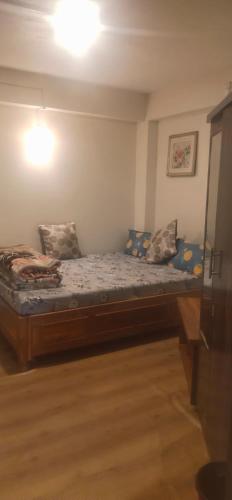 Giường trong phòng chung tại Yang's Stay