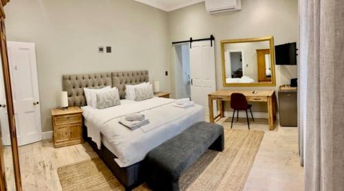 Ένα ή περισσότερα κρεβάτια σε δωμάτιο στο Sunset Farm Stellenbosch