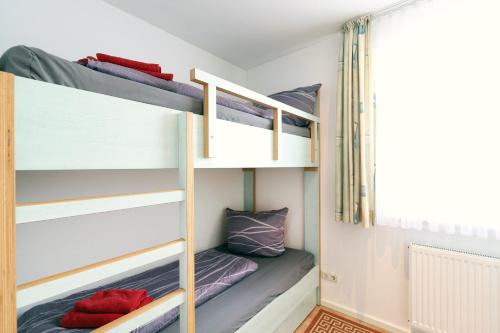 a bunk bed room with two bunk beds at Appartementhaus Strandnähe in Warnemünde