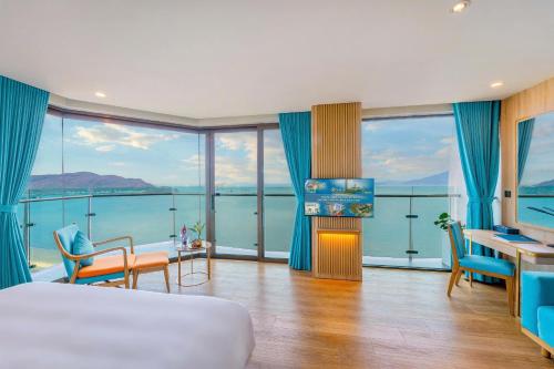 a hotel room with a view of the water at Sala Quy Nhon Beach Hotel in Quy Nhon