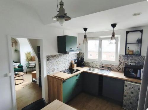 Køkken eller tekøkken på Appartement centre ville Amiens