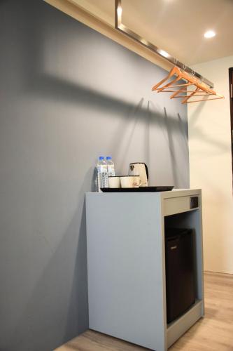 a white counter in a room with a wall at Yoyo Hotel in Chiayi City