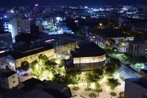 an aerial view of a city at night at Yoyo Hotel in Chiayi City