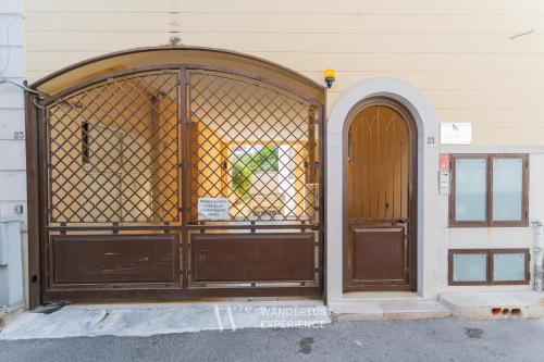an entrance to a building with a large wooden door at Wanderlust Experience La Casetta in Bitonto