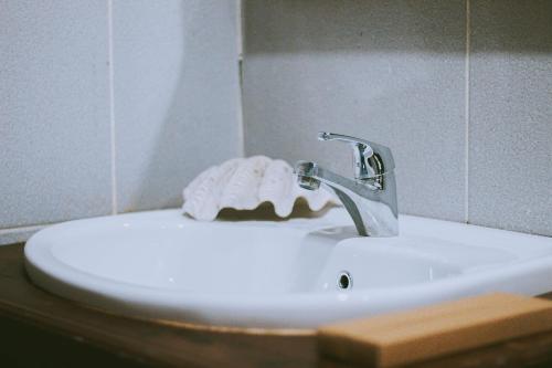 a bathroom sink with a towel on top of it at Andau Dive Resort Raja Ampat in Tapokreng