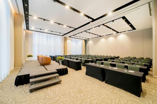 a large room with rows of tables and chairs at The Westin Sao Paulo in Sao Paulo