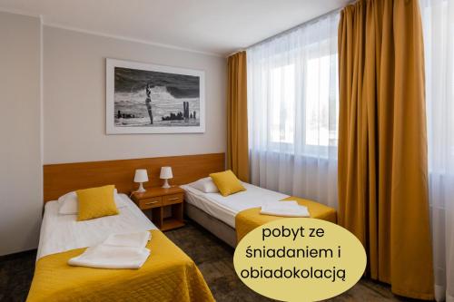Ένα ή περισσότερα κρεβάτια σε δωμάτιο στο Hotel Sport