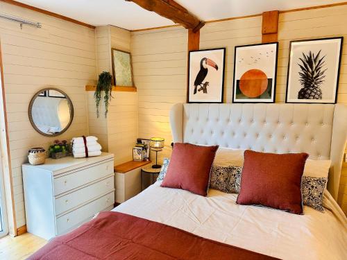 a bedroom with a bed and a desk and a mirror at The annex on our farm in Colwyn Bay
