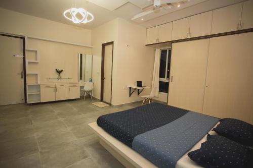 a bedroom with a large bed and a bathroom at Aeon Root Bridges by Tripture - Villa at Nandi Hills in Nandi