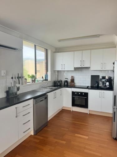 Kuchyň nebo kuchyňský kout v ubytování Rocky Beach unit