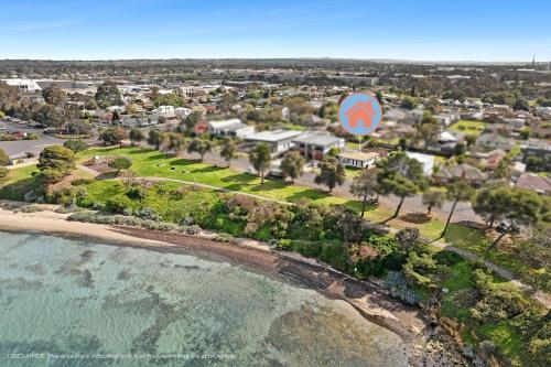 an aerial view of a beach with a large sign at Quiet Geelong Getaway I Bay views in North Shore