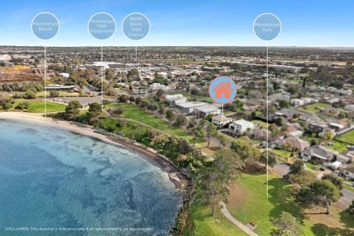 an aerial view of a beach with a street sign at Quiet Geelong Getaway I Bay views in North Shore