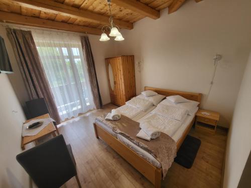 Postel nebo postele na pokoji v ubytování Zempléni Tündérkert vendégház