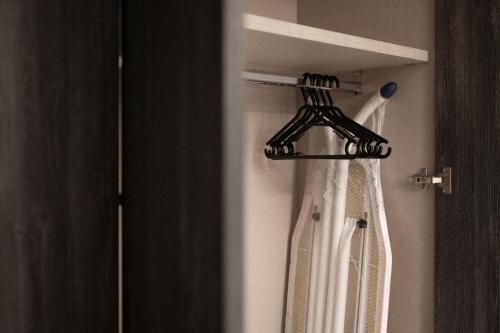 a shower curtain in a bathroom with a hanger at Marina Di Valletta View Apartment in Tal-Pietà