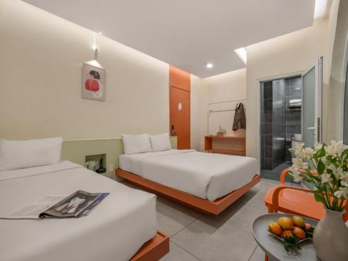 Кровать или кровати в номере Bazan Dalat Hotel