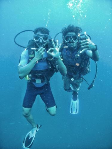 two people in the water making peace signs at THE VILLA Pondicherry in Puducherry