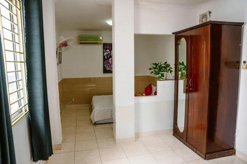 a hallway with a bathroom with a shower in it at Kim Thuy Hotel in Can Tho
