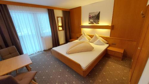 Ένα ή περισσότερα κρεβάτια σε δωμάτιο στο Zeitlos Apartments - Gerlos