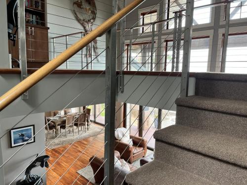 a staircase in a house with a stair railing at Ideal Beachfront Retreat Experience Gorgeous! in Friday Harbor
