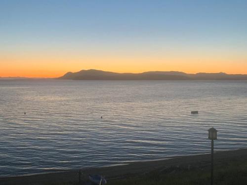 a view of the ocean at sunset at Ideal Beachfront Retreat Experience Gorgeous! in Friday Harbor