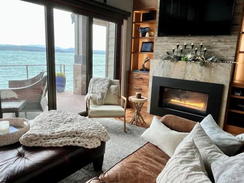 a living room with a couch and a fireplace at Ideal Beachfront Retreat Experience Gorgeous! in Friday Harbor