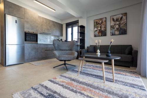 a living room with a couch and a table at Isol Rooms A1 in Katerini