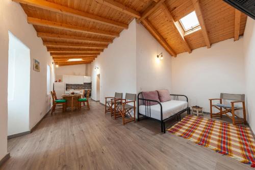 a living room with a couch and a table at A28 - Castela Street Townhouse in Espiche in Luz