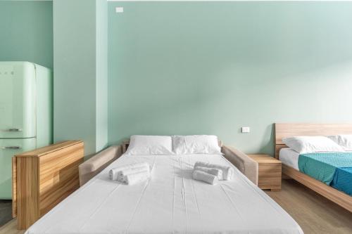 Postel nebo postele na pokoji v ubytování new cozyflat free wifi e AC 7 min Rho fiera