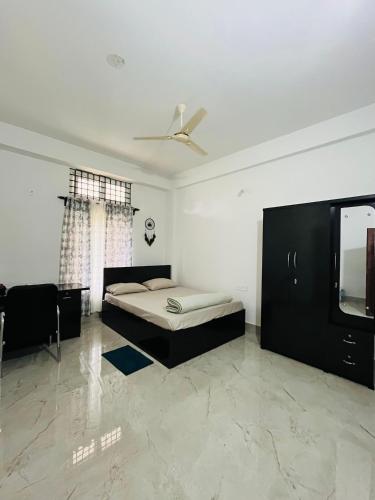 Ein Bett oder Betten in einem Zimmer der Unterkunft AiMa A Homely Abode