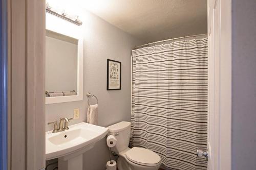 a bathroom with a sink and a toilet and a shower at Northside Abode Close to Downtown in Missoula