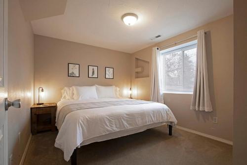 a bedroom with a large bed and a window at Northside Abode Close to Downtown in Missoula