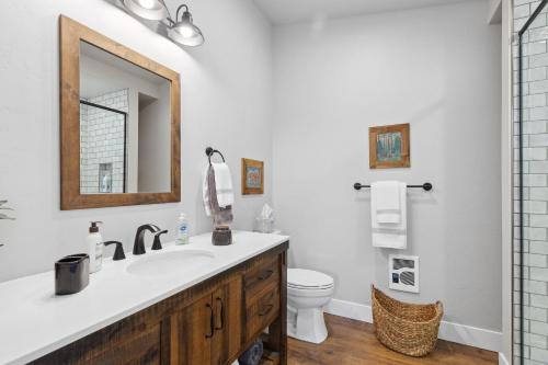 a bathroom with a sink and a toilet at Griz Country Cottage in Missoula