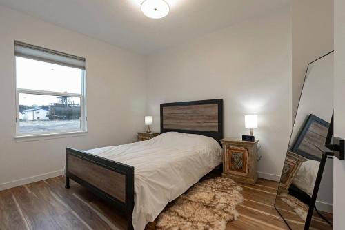 a bedroom with a large bed and a window at The Railway Flats 102 in Missoula
