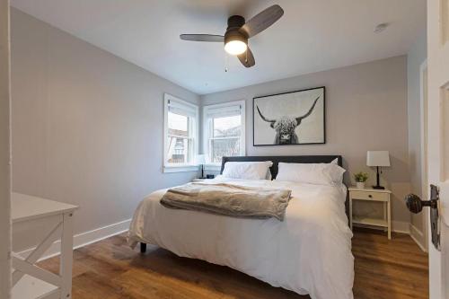 a bedroom with a bed and a ceiling fan at Slant Streets Bungalow in Missoula