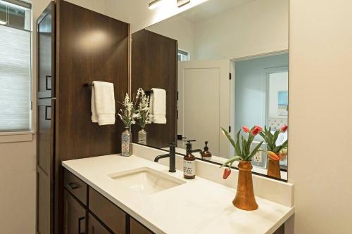 a bathroom with a sink and a mirror at The Railway Lofts 201 in Missoula
