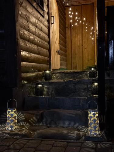 a room with a door and some lights and stairs at Готель White House in Yablunytsya