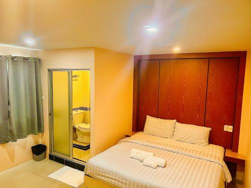 Postel nebo postele na pokoji v ubytování MK Residence, Pattaya